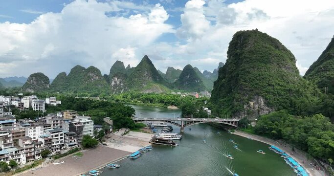 Aerial view of Yangshuo, Guangxi, China, beautiful scenery with blue sky and white clouds, river passing through karst landform
