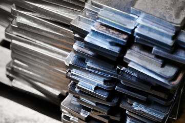 Shiny rectangle metal details on wooden pallet in warehouse