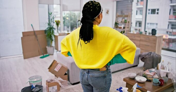 Cleaning, frustrated woman and back with messy living room and lounge at home with maintenance. Worker, house and maid tired from housekeeping chaos with job care with female cleaner and service