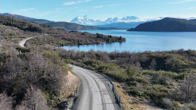 Patagonia Road At Puerto Natales In Ultima Esperanza Chile. Snowy Mountains. Road Landscape. Ultima Esperanza Chile. Winter Background. Patagonia Road At Puerto Natales In Ultima Esperanza Chile.