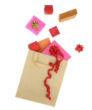 Christmas presents, gift boxes out of a shopping bag isolated on white transparent background, PNG. 