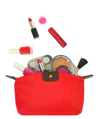 Cosmetics makeup products out of a red purse isolated on white transparent background, PNG.  - 636538938