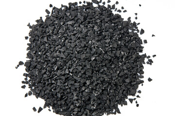 Top view of activated carbon scattered isolated on white background. activated carbon is used for...