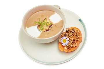 Top view of Creamy mushroom and truffle soup with bread isolated on white background.