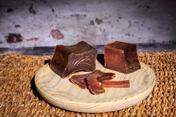Tacos and slices of cured tuna loin, called in Spain mojama, a delicacy of Arab origin produced on the southern coast of Spain, close-up.