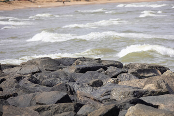 Waves crashing into rocks in beach
