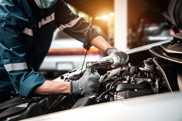 Car care maintenance and servicing, Hand technician auto mechanic using the wrench to fix car or...