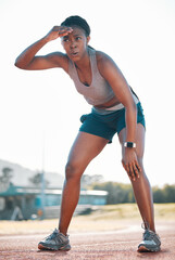 Sweating, tired and black woman at stadium for a race, training or breathing after cardio. Sports, workout and an athlete or African runner with a break after fitness, running or exercise on a track