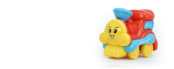 colorful plastic train toy isolated on white background with copy space for toy store banner