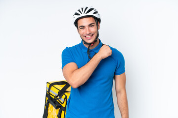 Young caucasian man with thermal backpack isolated on white background celebrating a victory