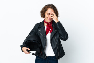 Fototapeta premium English woman holding a motorcycle helmet isolated on white background laughing