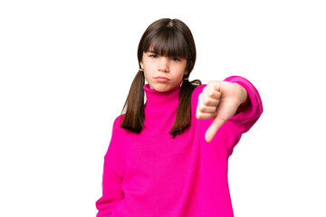 Little caucasian girl over isolated background showing thumb down with negative expression