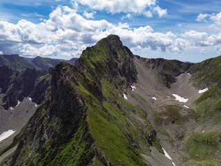 Naklejka premium Aerial view of Vânătarea lui Buteanu, the eighth-highest mountain peak in Romania, located not far from the Transfagaras Mountain Pass.