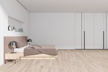 Cozy hotel bedroom interior with bed and decoration. Mock up wall