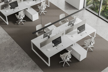 Top view of business room interior with pc desktop and chairs near window