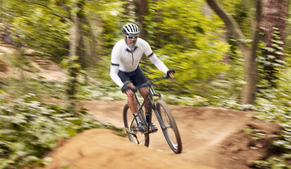Fototapeta premium Nature cycling, bicycle and sports man travel, ride and journey on off road path, outdoor challenge or exercise. Fast mountain bike, speed blur and athlete training, fitness and workout in forest