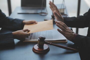 Business and lawyers discussing contract papers with brass scale on desk in office. Law, legal...