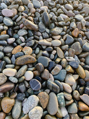 sea ​​stones pebbles lighting before sunset top view