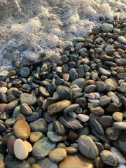 sea ​​foam on the rocks near the sea