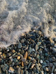 sea ​​foam on the rocks near the sea