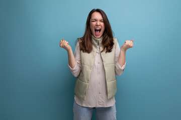 Fototapeta premium happy cute young brunette woman screaming with joy
