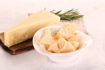 Chopped Italian hard parmesan cheese