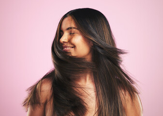 Hair care, smile and woman shaking head in studio, luxury salon treatment and shine with texture....