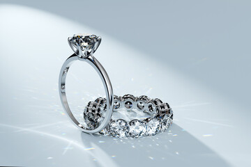 Solitaire diamond ring, eternity ring in a spotlight on white background.