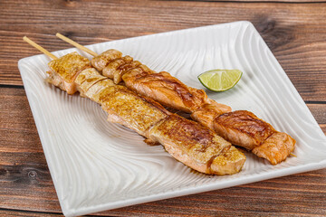 Grilled salmon skewer with sauce