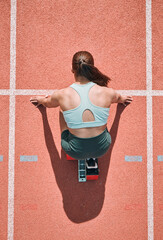 Start, running and fitness with woman on race track from above for sports, competition and...