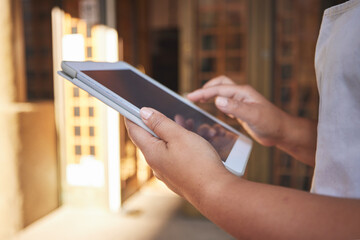 Restaurant, tablet and hands of person online for food service, planning inventory and check sales. Coffee shop, small business and waitress, barista or woman manager on digital tech for cafe website