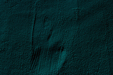 Teal colored abstract wall background with textures of different shades of teal