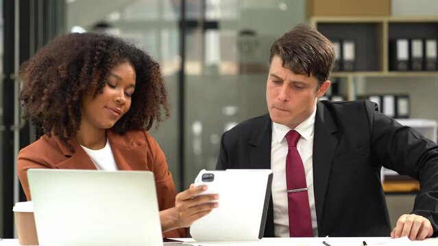 Businessmen team or financial data analysts working with tablets and laptop computers and data graphs together. Plan to analyzing projects in the office.