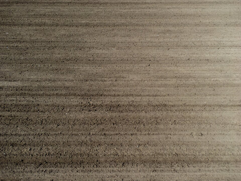 Aerial View Of A Plowed And Cultivated Field For Background