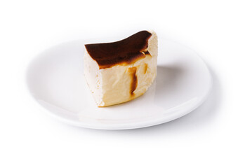 San sebastian cheesecake on plate isolated