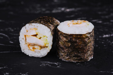 Eel fish sushi rolls set on black © AntAlexStudio