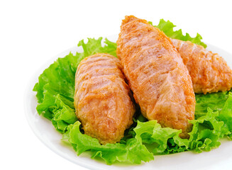 Three chicken meatballs on lettuce leaves