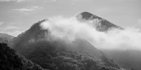 Alps mountains in clouds, black and white