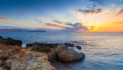 Fototapeta na wymiar Beautiful landscape. Coast of the island of Crete - Greece area of Lerapetra Eden Rock. Beautiful sky at sunrise over the sea
