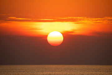 Big sun and sea evening background. Nature composition.