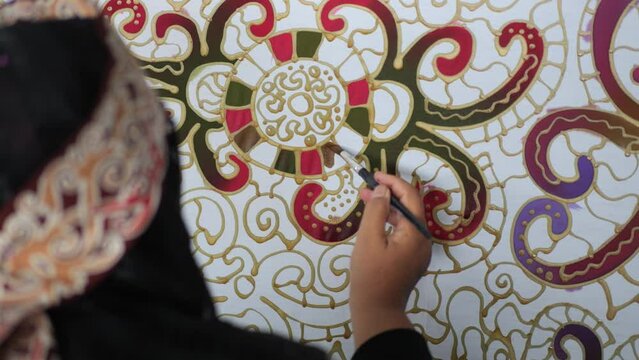 Making batik tulis Borneo. The technique of making batik by writing using a canting tool. Canting consists of nyamplung, cucuk, gagang or handles made of copper, bamboo and wax