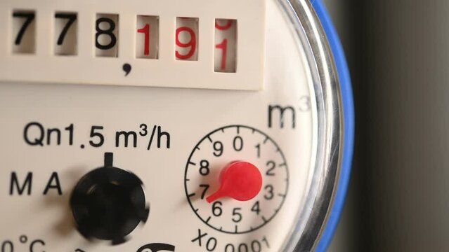 Water meter in the home water supply system. Close-up.
