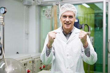 scientist feeling happy and doing winner gesture in testing lab