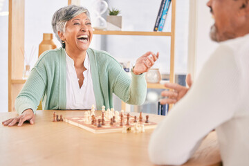 Laughing, game and senior couple with chess in a house in retirement for a competition. Happy, together and a funny and elderly man and woman with a board for a challenge or bonding with conversation