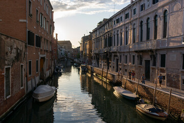 Venetian street during sunset. Venice, Italy.