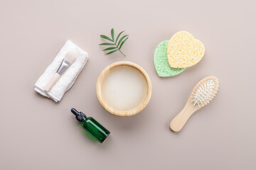 Homemade cosmetic rice water with ingredients on beige background, healthy beauty treatment ingredients for homemade comsetics, beauty recipe for home spa, natural skincare preparation, top view