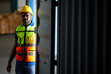 factory worker or engineer looking at inside container in the warehouse storage