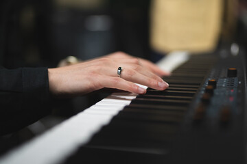Obraz premium close-up of a pianist's hands while playing the piano