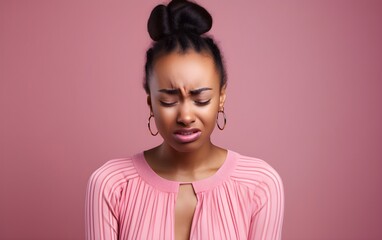 Fototapeta premium Closeup portrait photo of young crying attractive African American woman with unhappy sad face, problem, depressed, offended isolated on modern pastel pink color background, AI Generated