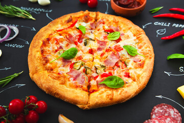 Pizza, ingredients and product names written in chalk on a black background.